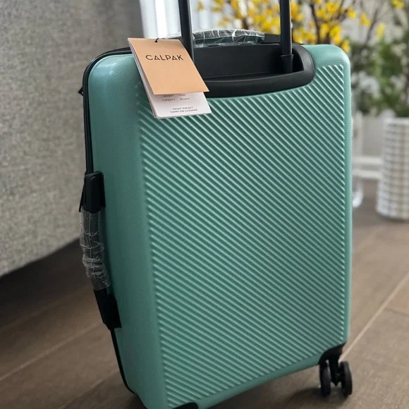 New! CALPAK 22” Hardside Carry-on Spinner With Front Pocket